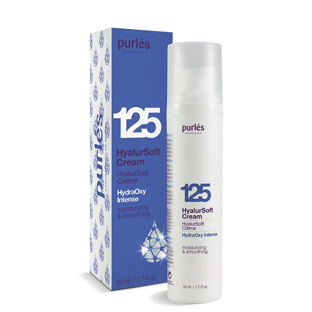 Ein weißer Flakon von Purlés HydraOxy Intense 125 HyalurSoft Cream steht neben seiner blau-weißen Schachtel. Die Verpackung weist auf die feuchtigkeitsspendenden und glättenden Eigenschaften hin und enthält 50 ml des Produkts.