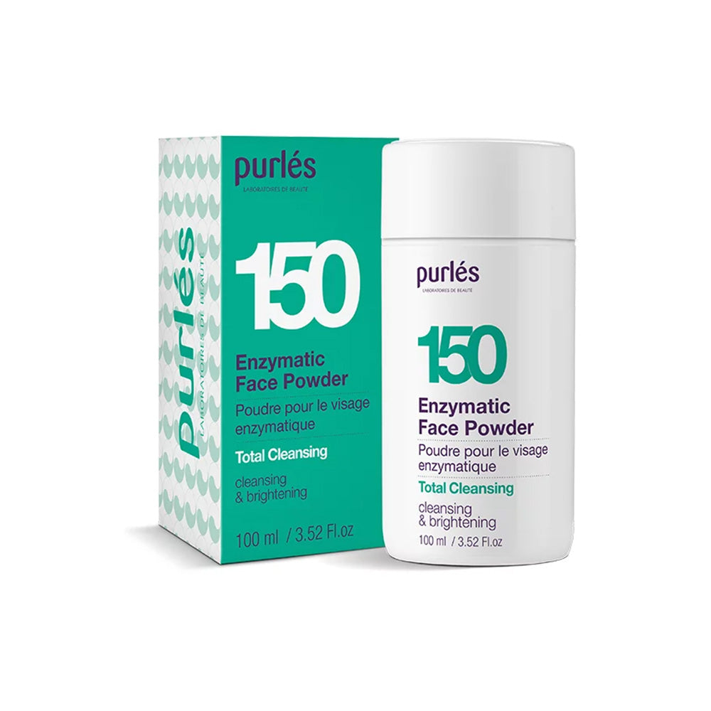Eine Schachtel und eine Flasche Purlés Total Cleansing 150 Enzymatic Face Powder (100 ml), beschriftet in Englisch und Französisch, mit weißer und blaugrüner Verpackung von Purlés.