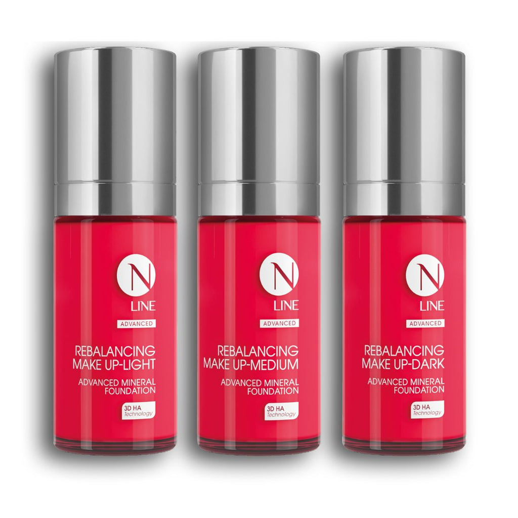 Drei Flaschen NEAUVIA NLINE Rebalancing Make Up - Light, Medium und Dark - sind nebeneinander in einer rot-silbernen Verpackung ausgestellt.